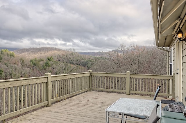 wooden terrace featuring a mountain view