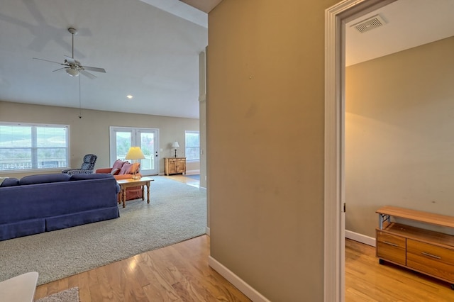 hallway with light hardwood / wood-style flooring