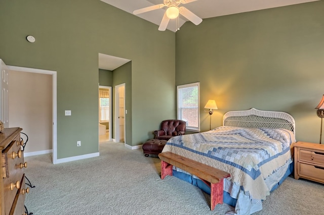 carpeted bedroom featuring ceiling fan and high vaulted ceiling