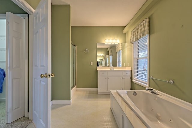 bathroom featuring shower with separate bathtub and vanity