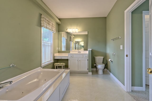 bathroom with vanity, toilet, and a bath