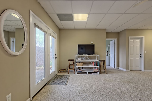 interior space with light carpet and a drop ceiling