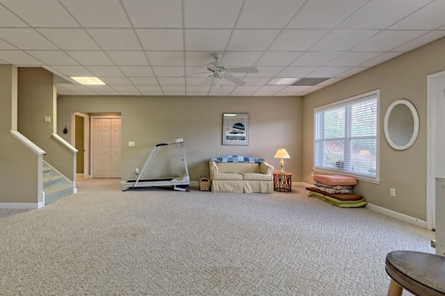 game room featuring a paneled ceiling, light colored carpet, and ceiling fan