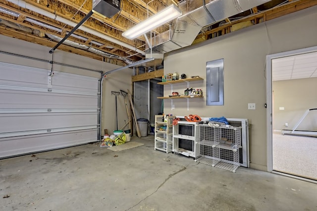 garage with a garage door opener and electric panel