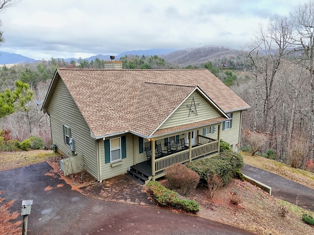 view of front of property featuring a mountain view and a porch