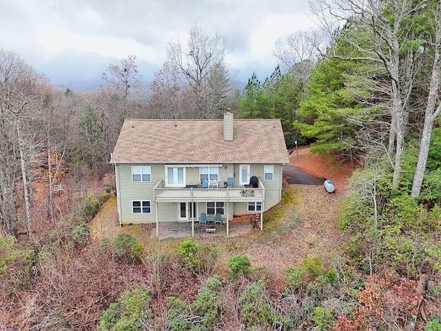 rear view of house with a deck