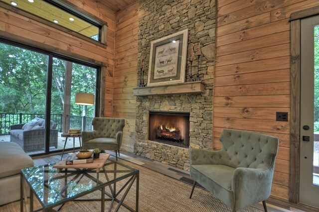 living room featuring wood-type flooring and a fireplace