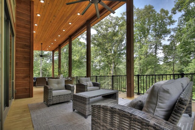 exterior space featuring ceiling fan and wood ceiling