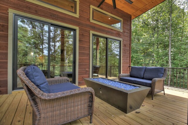 exterior space featuring an outdoor living space with a fire pit