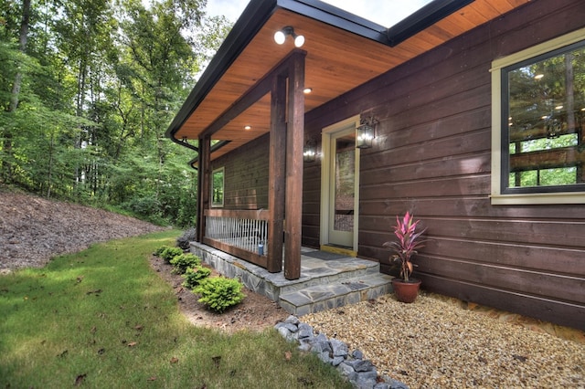 view of side of home featuring a yard