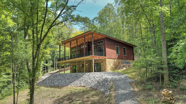 contemporary home with cooling unit and a balcony