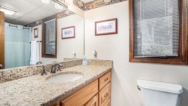 bathroom featuring toilet, visible vents, and vanity