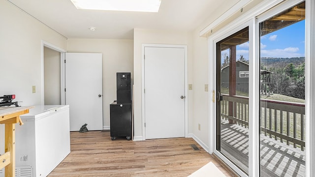 interior space with visible vents and light wood-style flooring