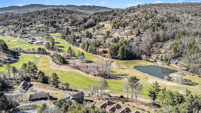 birds eye view of property with golf course view and a water and mountain view