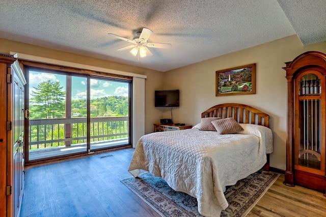 623 Overlook Way, Sky Valley, GA 30537 - bedroom featuring wood finished floors, a ceiling fan, access to exterior, a textured ceiling, and visible vents