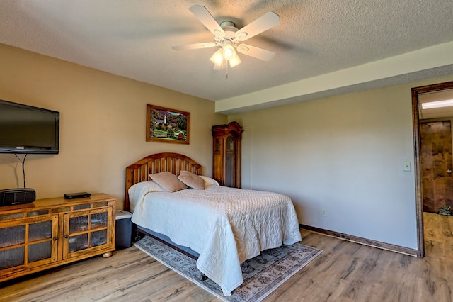 623 Overlook Way, Sky Valley, GA 30537 - bedroom with ceiling fan, a textured ceiling, and wood finished floors