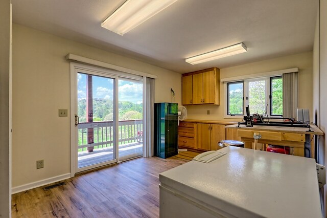 623 Overlook Way, Sky Valley, GA 30537 - kitchen featuring freestanding refrigerator, light wood-type flooring, visible vents, baseboards, and light countertops