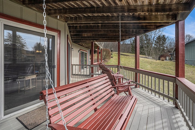 wooden terrace with a yard