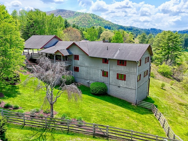 623 Overlook Way, Sky Valley, GA 30537 - rear view of property featuring fence, a shingled roof, a mountain view, and a lawn