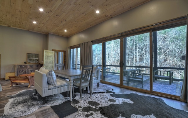 dining area featuring recessed lighting, plenty of natural light, wooden ceiling, and wood finished floors