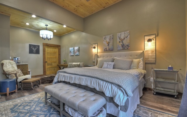 bedroom featuring recessed lighting, wood finished floors, wooden ceiling, and an inviting chandelier