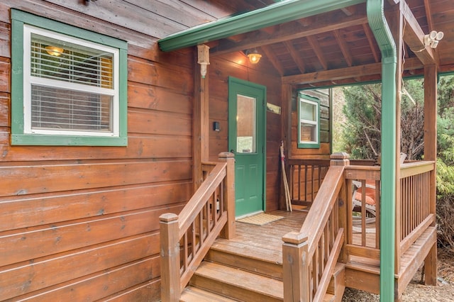 property entrance featuring a wooden deck