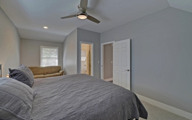 bedroom with ceiling fan, carpet, baseboards, and vaulted ceiling