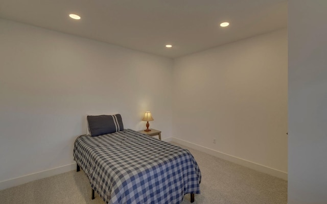 carpeted bedroom featuring recessed lighting and baseboards