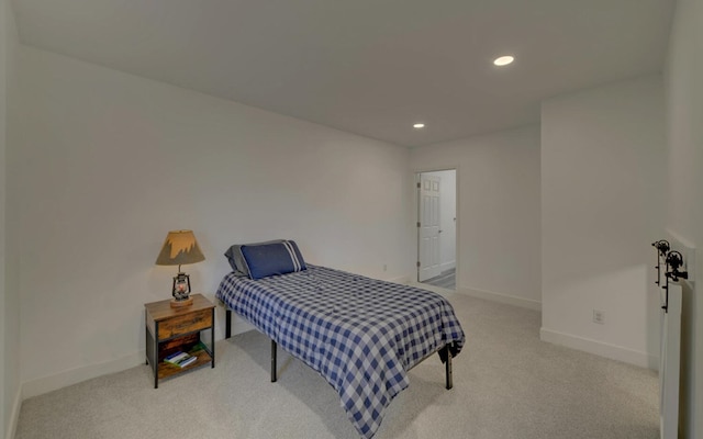 bedroom with recessed lighting, light colored carpet, and baseboards