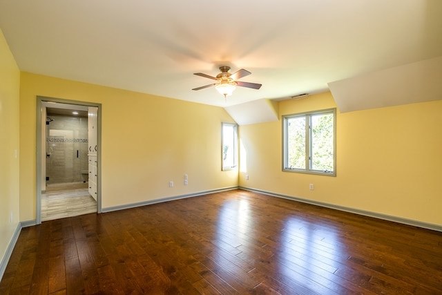 unfurnished room featuring a ceiling fan, hardwood / wood-style floors, and baseboards