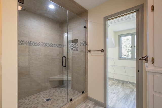 bathroom with a shower stall and recessed lighting