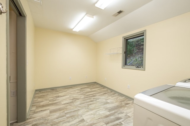 washroom featuring separate washer and dryer and baseboards