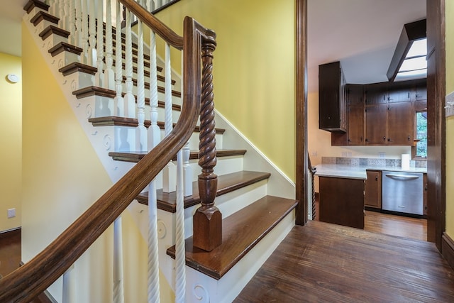 stairs with wood finished floors