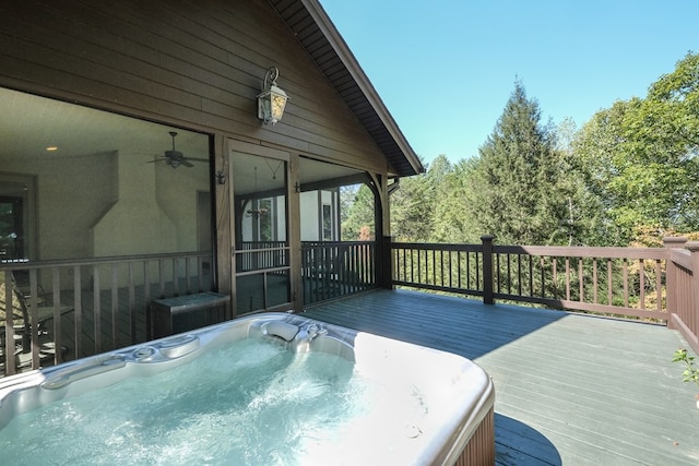 wooden terrace with a hot tub, a sunroom, and central air condition unit