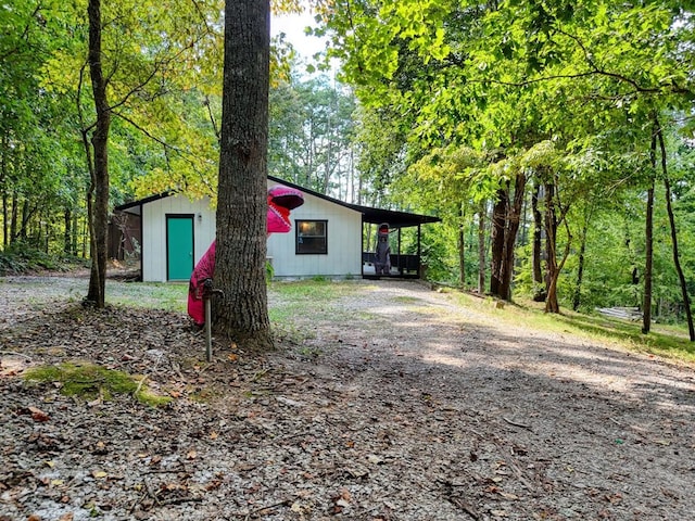 view of property exterior with a carport