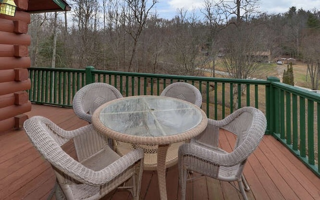 wooden deck with outdoor dining space