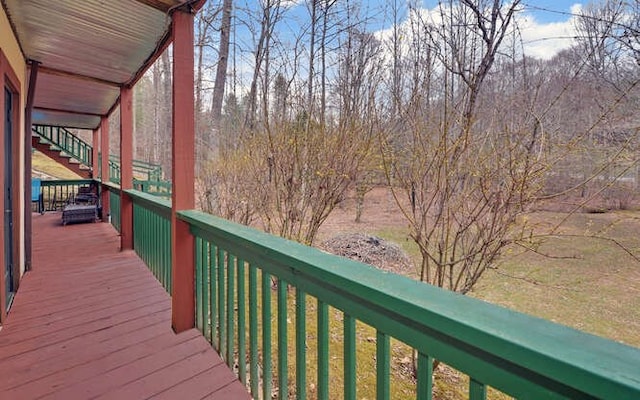 wooden deck featuring stairs