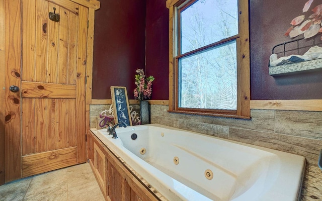 bathroom with plenty of natural light and tile flooring