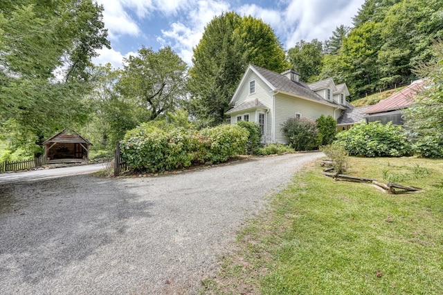 exterior space featuring gravel driveway