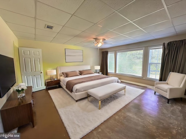 3273 Ivy Log Rd, Blairsville, GA 30512 - bedroom featuring a drop ceiling, concrete flooring, ceiling fan, and baseboards