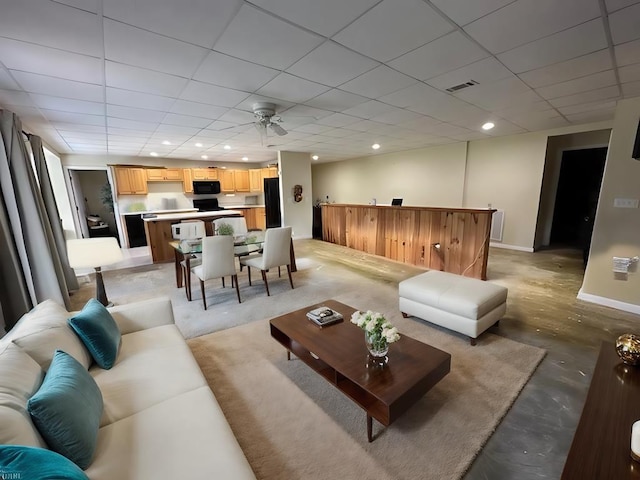 3273 Ivy Log Rd, Blairsville, GA 30512 - living area featuring concrete flooring, baseboards, bar, recessed lighting, and a paneled ceiling