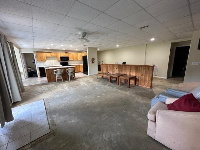 3273 Ivy Log Rd, Blairsville, GA 30512 - living area featuring unfinished concrete floors, a paneled ceiling, ceiling fan, recessed lighting, and bar area