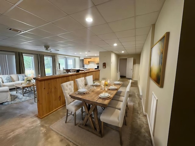 3273 Ivy Log Rd, Blairsville, GA 30512 - dining room with concrete floors, a drop ceiling, and ceiling fan