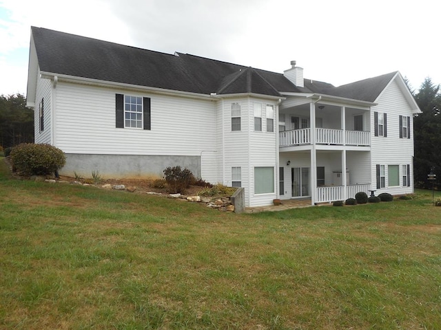 3273 Ivy Log Rd, Blairsville, GA 30512 - rear view of property with a balcony, a chimney, and a yard