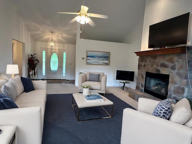 3273 Ivy Log Rd, Blairsville, GA 30512 - living area featuring a ceiling fan, high vaulted ceiling, carpet floors, and a stone fireplace