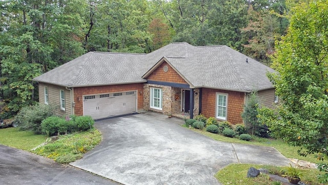10 Quiet Place Ln, Clayton, GA 30525 - view of front facade with an attached garage, concrete driveway, a shingled roof, and a wooded view