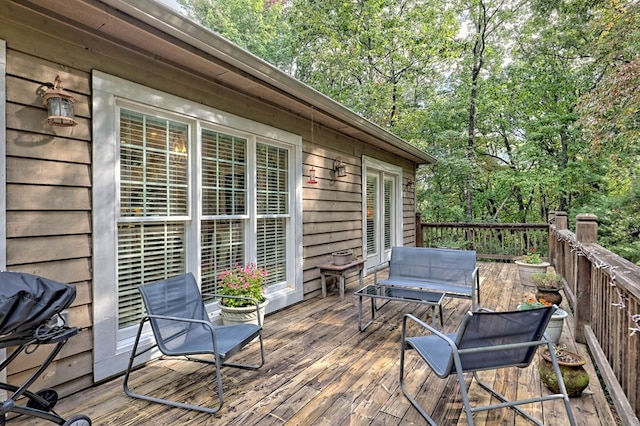 wooden terrace featuring grilling area