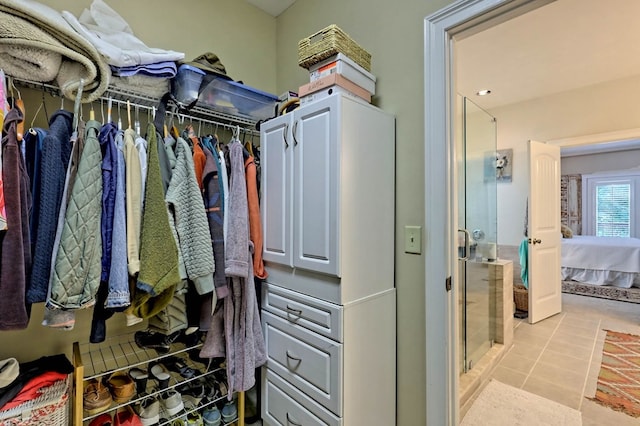 spacious closet featuring light tile patterned floors