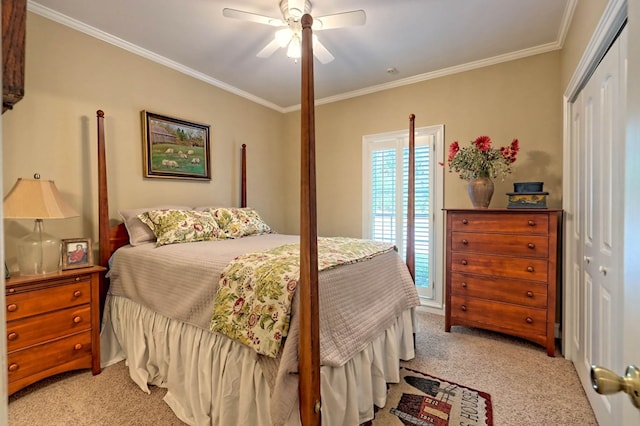 bedroom with a closet, ornamental molding, light colored carpet, and ceiling fan