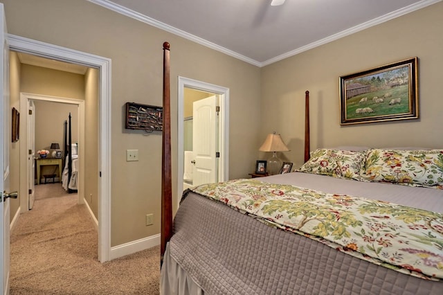 bedroom with crown molding, ensuite bathroom, light colored carpet, and ceiling fan